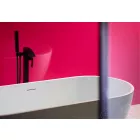 Fuchsia Gloss Cladding installed in Bathroom with white bath, black tap unit and shower screen.
