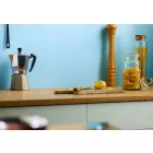 Sky Satin Cladding installed in kitchen above wooden work surface with Kitchen accoutrements.