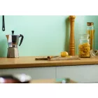 Willow - Satin Cladding installed in above a wood coloured Kitchen Worktop with Glass Jar's and Pepper Grinder.