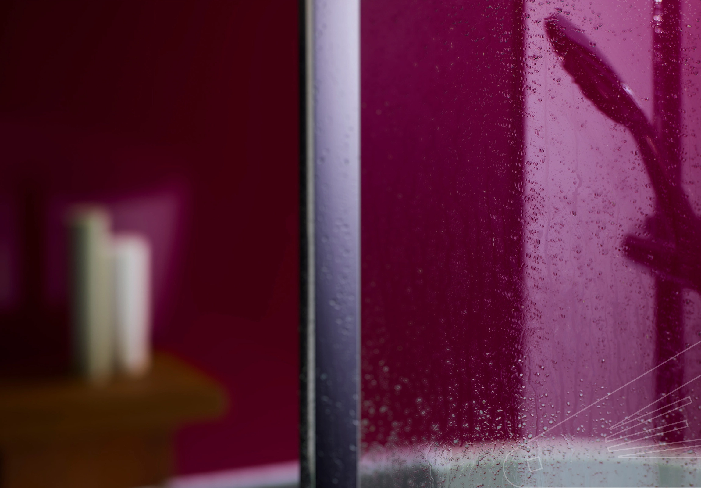 Plum Gloss Cladding installed in a bathroom showing a still wet shower screen and reflection of shower head in the cladding.
