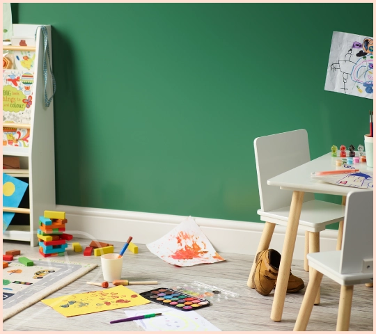 A close-up of featured colour Forest Satin cladding installed in a child's play area.