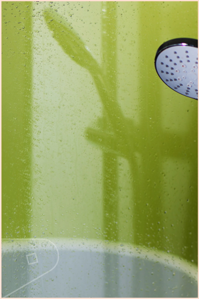 Image of man covering tiles in kitchen with wall cladding panel