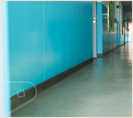 Atlantic Blue Satin uPVC Wall Cladding installed in school hallway high traffic area a durable wall solution.